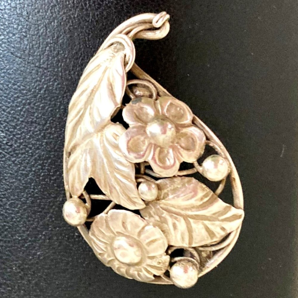Textured vintage floral brooch in sterling